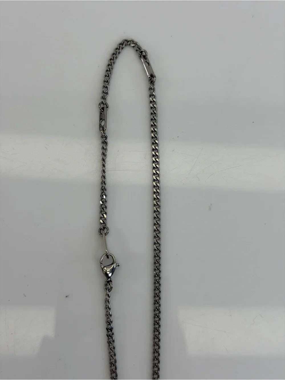 Louis Vuitton Silver LV Monogram Row Pendant Necklace